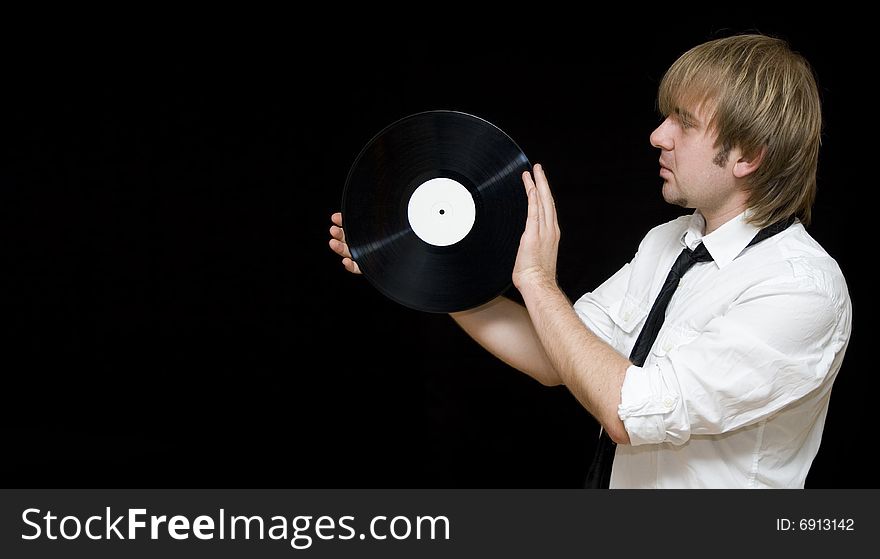 Young office worker holding a vinyl record