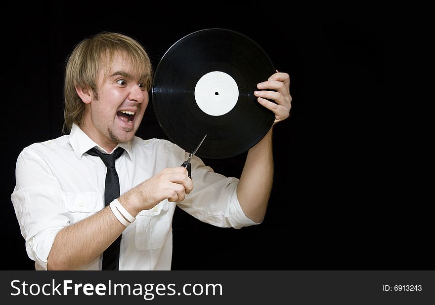 Young man cut vinyl record and screaming