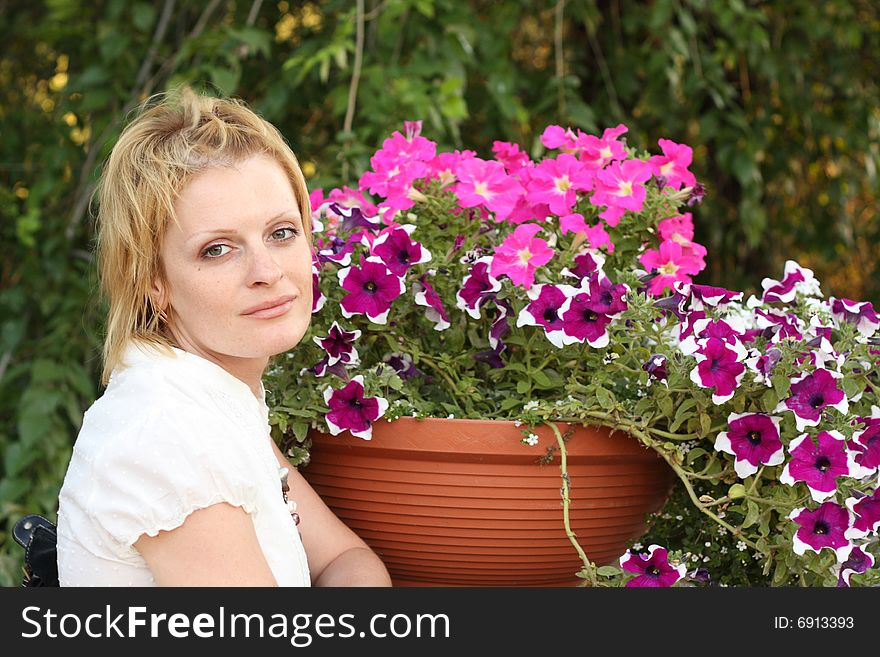 She is the girl with flowers outdoors