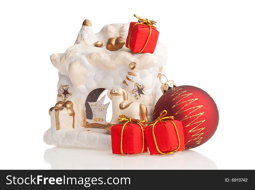 Ceramic fireplace, Christmas ball and tiny present boxes, isolated. Ceramic fireplace, Christmas ball and tiny present boxes, isolated