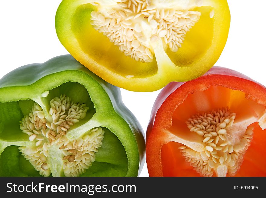 Peppers in three colors, against a white background isolate