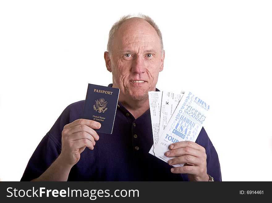 An older guy with a passport and airline tickets. An older guy with a passport and airline tickets