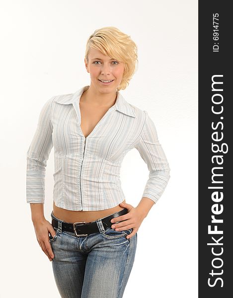 Portrait of a young woman.Wearing a blouse and jeans. Portrait of a young woman.Wearing a blouse and jeans.