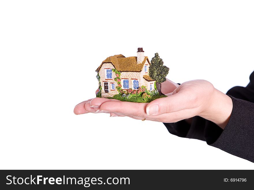 Hands holding house on the white background