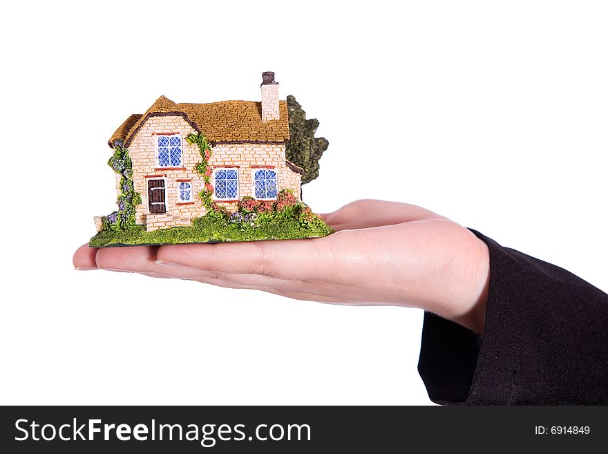 Holding small house on the white background. Holding small house on the white background
