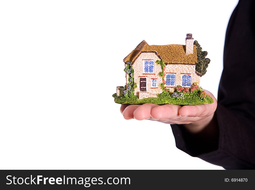 Holding small house on the white background. Holding small house on the white background