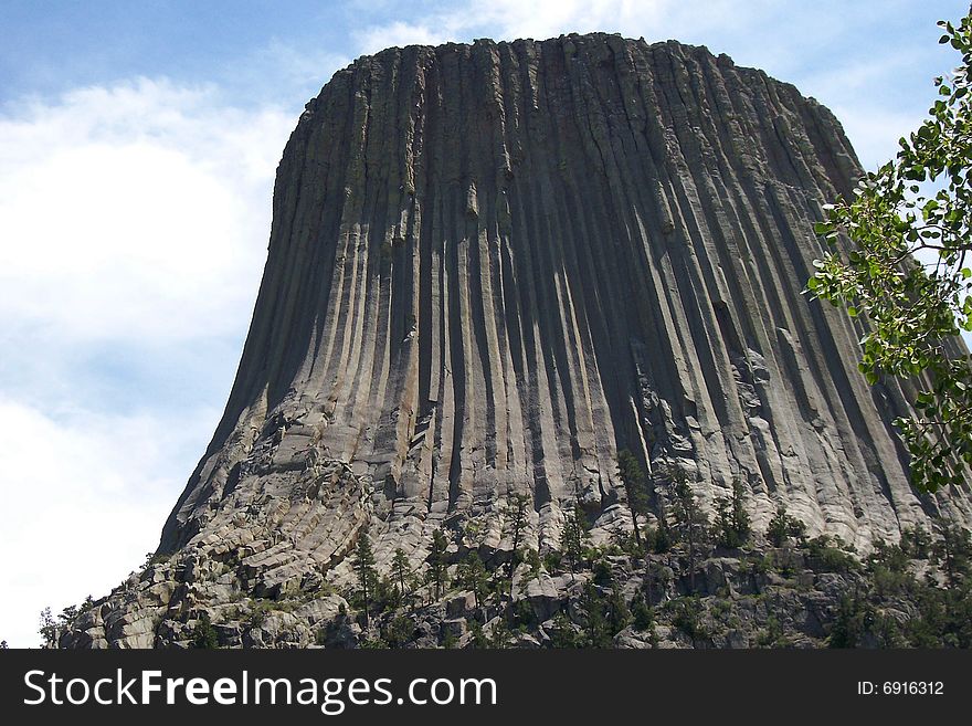 Devil's Tower in Wyoming.  The story is told that the grooves and ridges are made from a bear's claw. Devil's Tower in Wyoming.  The story is told that the grooves and ridges are made from a bear's claw.
