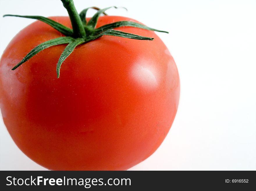 Red ripe tomato on a white background