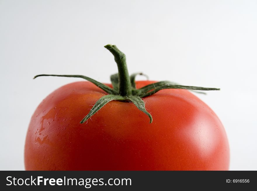 Red ripe tomato on a white background