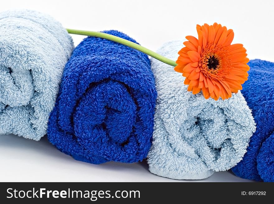 Blue towels with flower on white background