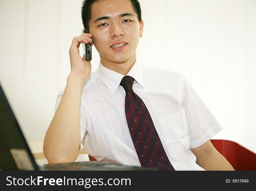 Young asian businessman in office