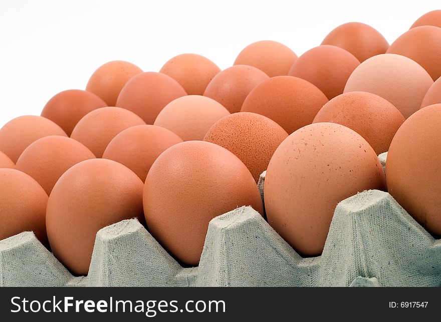 Closeup of chicken eggs on white background