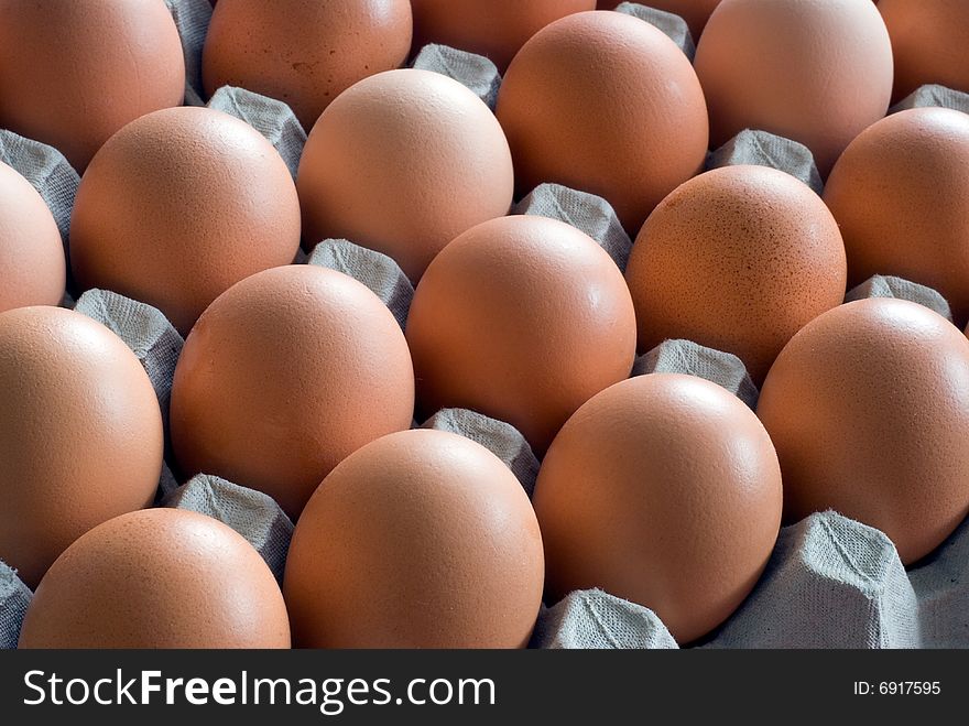 Closeup of chicken eggs on white background