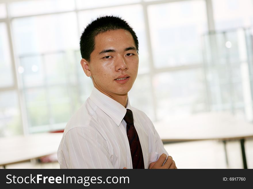 Young asian business man in office. Young asian business man in office