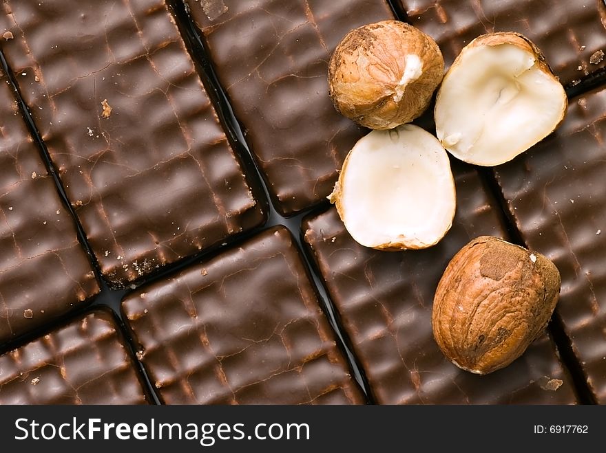 Background of chocolate cookies with nuts