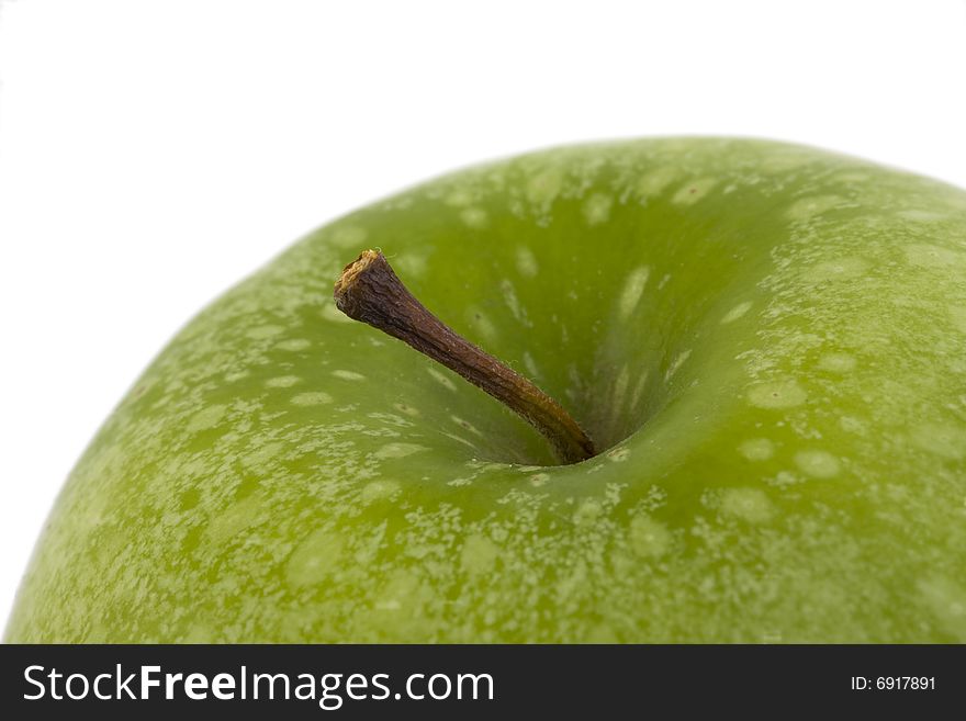 Detail of a granny smith  apple isolated on white background