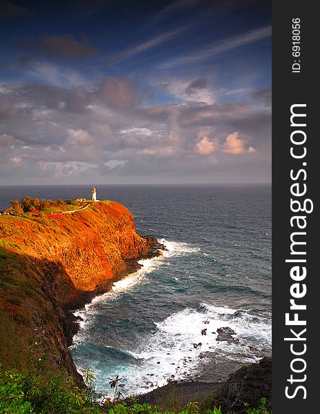 Lighthouse at Kilauea Bay on the island of Kauai, Hawaii under a dramatic sky