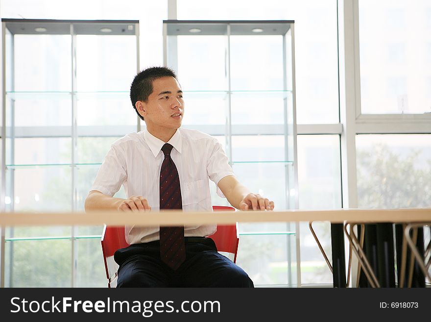 Young asian businessman sit in office. Young asian businessman sit in office