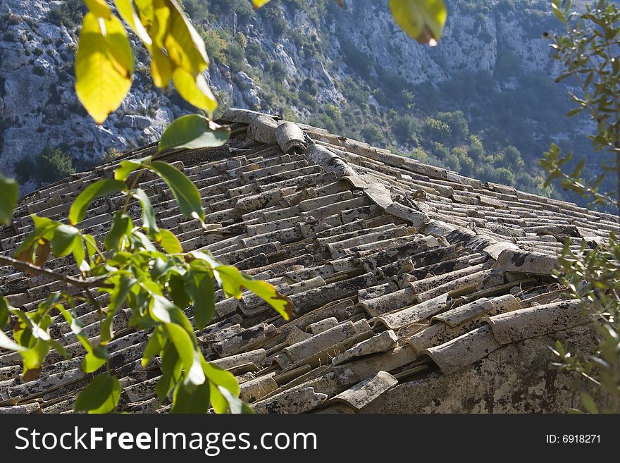 Ancient roof tiles of an old mountain home. Ancient roof tiles of an old mountain home