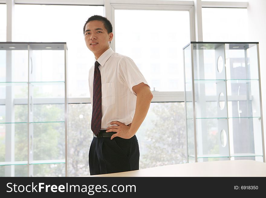 Young asian business man in office. Young asian business man in office