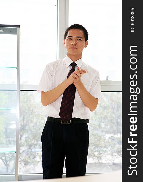 Young asian business man in office. Young asian business man in office