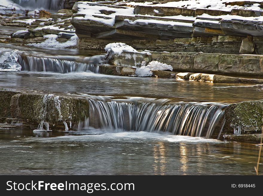 Small falls on a mountain stream in the winter.