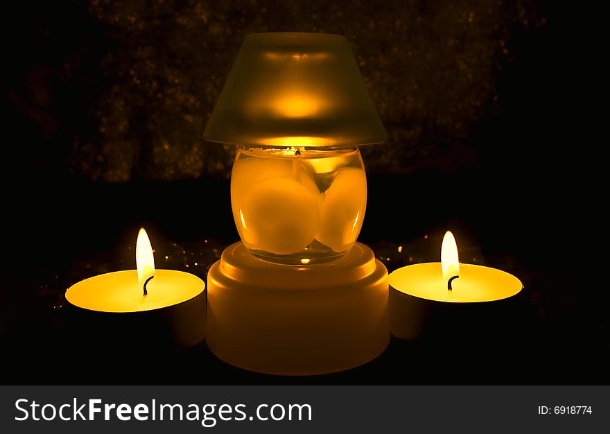 Group of candles against a dark background