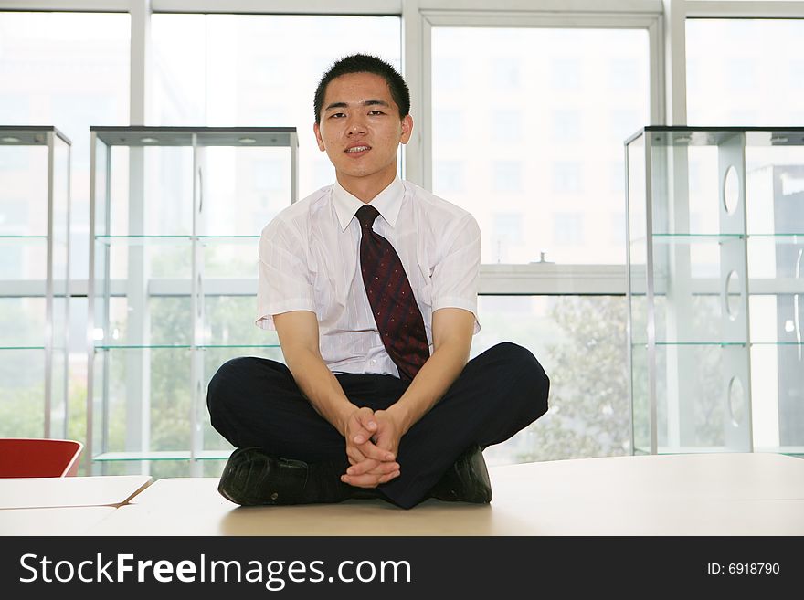 Young asian businessman sit in office. Young asian businessman sit in office