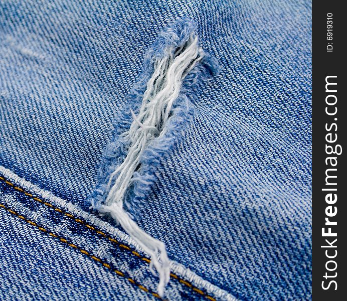 Old blue jeans close up. Old blue jeans close up