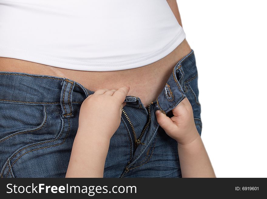 Children's hands last to clasp jeans at the girl