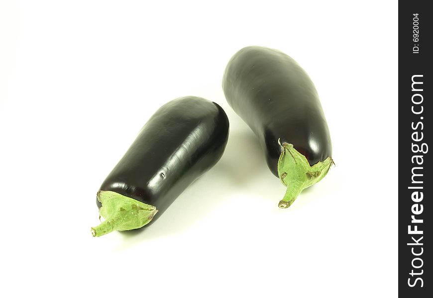 Two aubergines on isolated white background. Two aubergines on isolated white background.