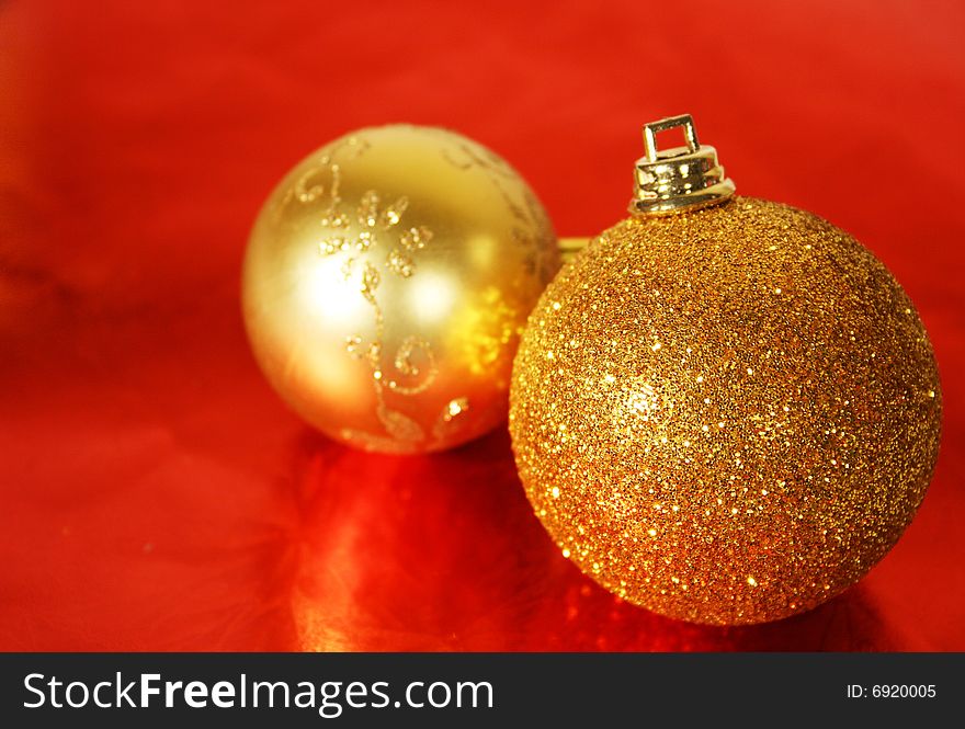 Golden Christmas ornament on red background
