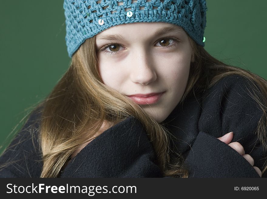 Teen girl in a hat and coat