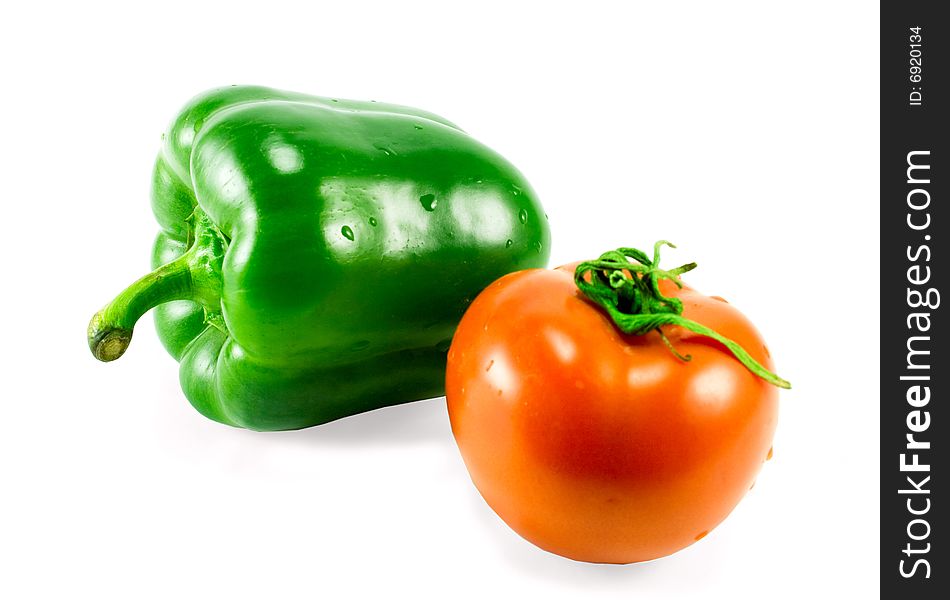 Bell pepper and tomato isolated on white background