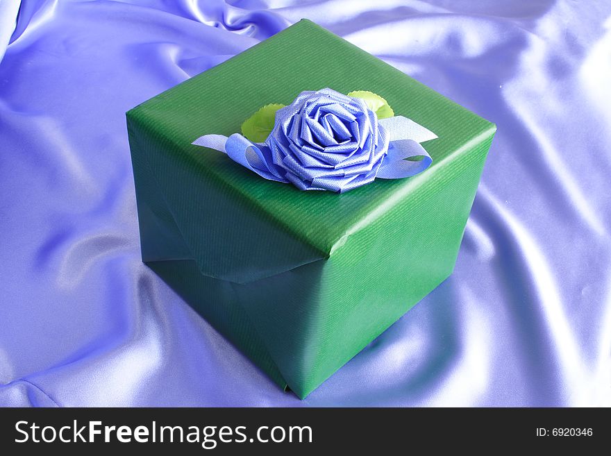 Green box with beautiful blue flower bow. Green box with beautiful blue flower bow