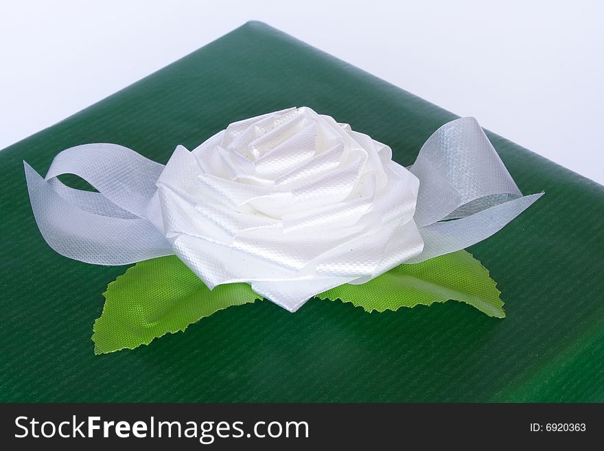 Close up of green box and white flower. Close up of green box and white flower