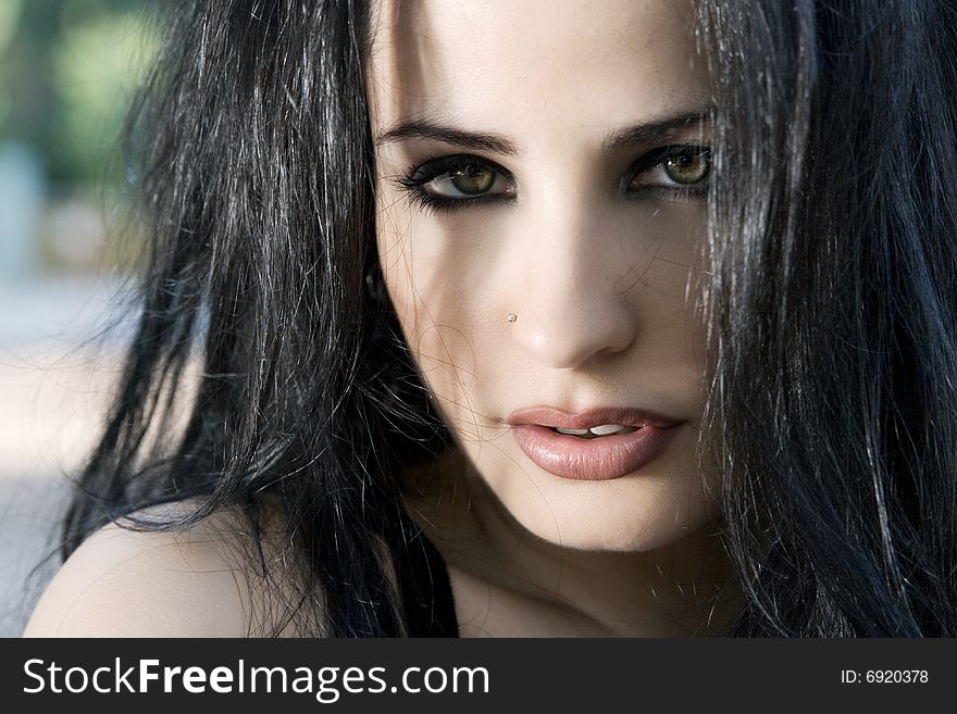 A glamour portrait of a beautiful young brunette woman. A glamour portrait of a beautiful young brunette woman