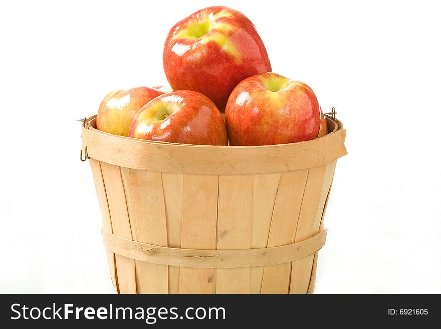 Crisp fall apples in a small wooden bushel. Crisp fall apples in a small wooden bushel.