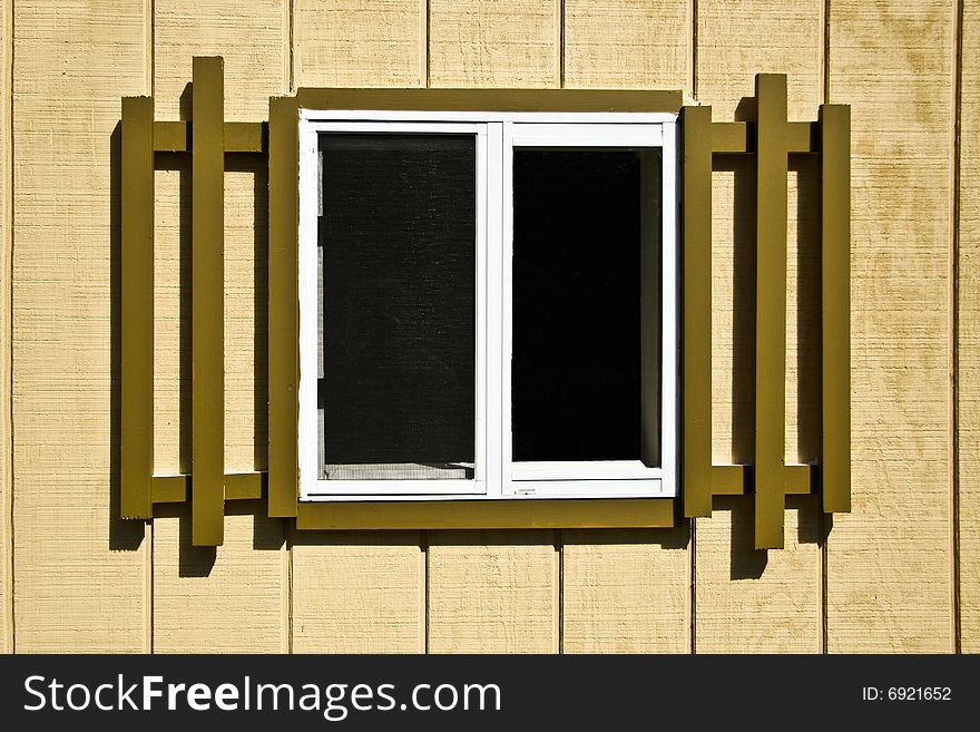 Exterior window of brown shed. Exterior window of brown shed