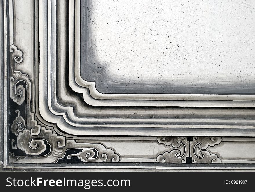 A black and grey decorative frame from a Buddhist temple