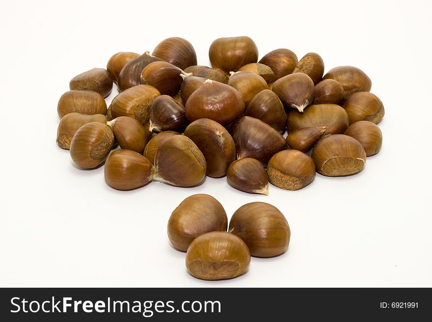 Brown chestnuts isolated on white background