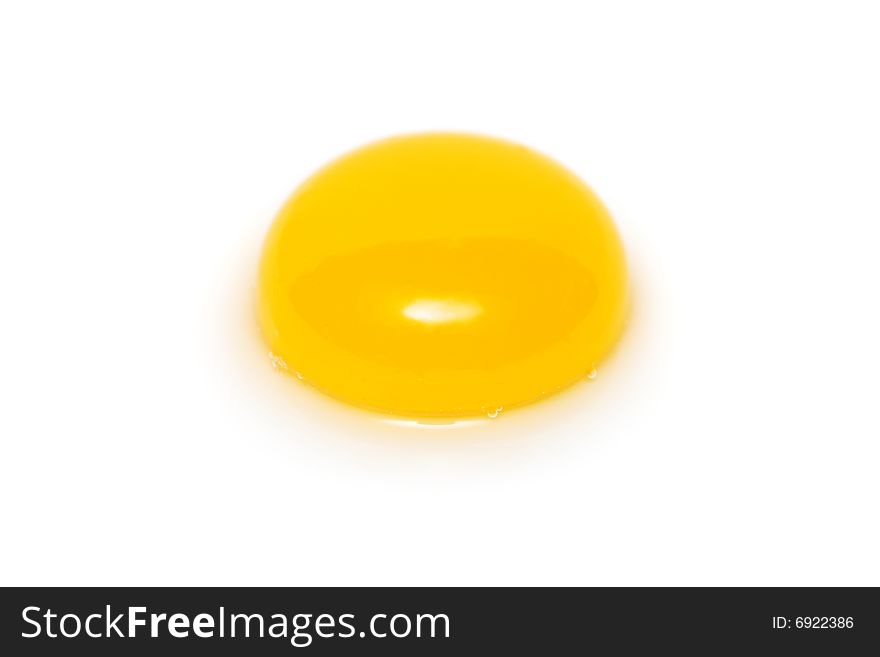 Close up of a yolk isolated on white background.
