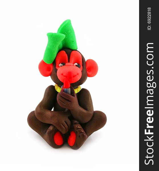 Colored plasticine monkey isolated on a white background