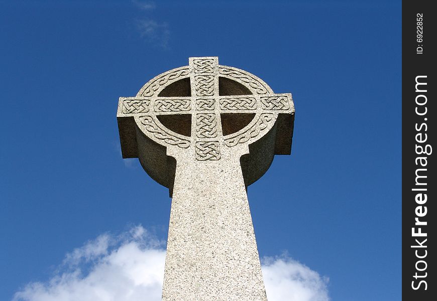 Old carved Celtic cross reaching skyward in Llandinam, Wales. Old carved Celtic cross reaching skyward in Llandinam, Wales