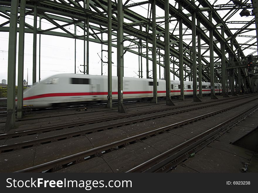 Speedy Train on Hohenzollern Bridge in Cologne, Germany. Speedy Train on Hohenzollern Bridge in Cologne, Germany.