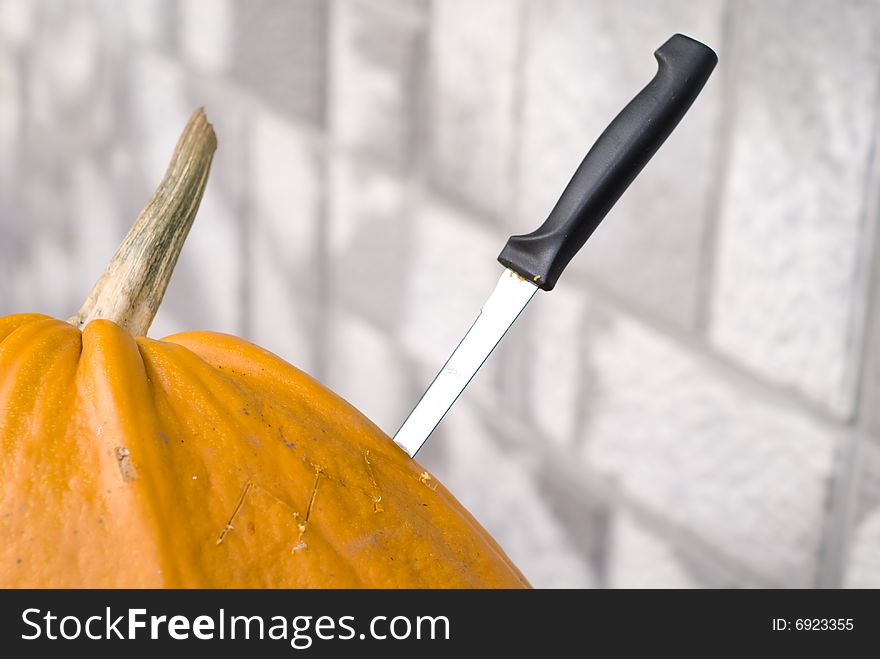 Pumpkin for Halloween with knife.