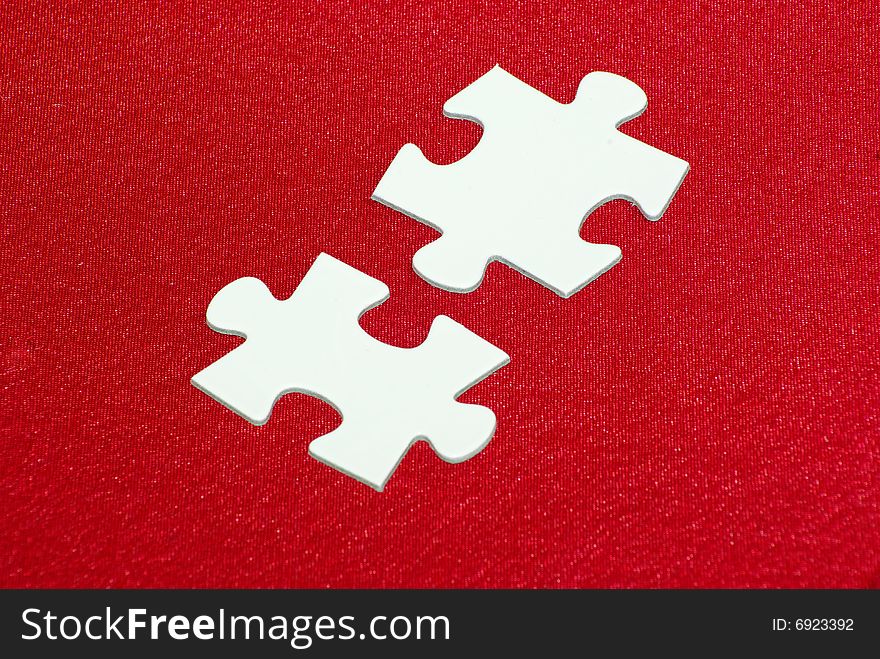 White puzzles isolated on a red