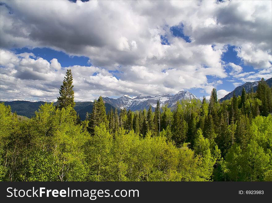 Rocky Mountains in the Spring with blue sky and clouds. Rocky Mountains in the Spring with blue sky and clouds