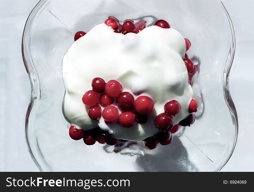 Red berry with cream in glass