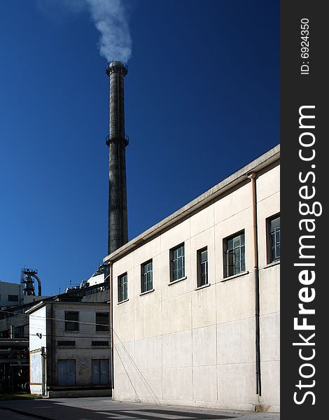 Tall chimney of a coal factory in china for the production of heat and electricity. Tall chimney of a coal factory in china for the production of heat and electricity